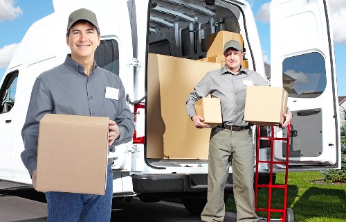 Packed office furniture ready for transport on a North London street