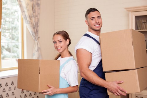 Packed moving boxes and household items ready for removal